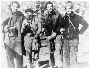 Just back from a mission behind Franco’s lines, probably late 1937. From left to right: Bill Aalto, a Spanish guerrilla fighter, Alex Kunstlich, and Irv Goff.