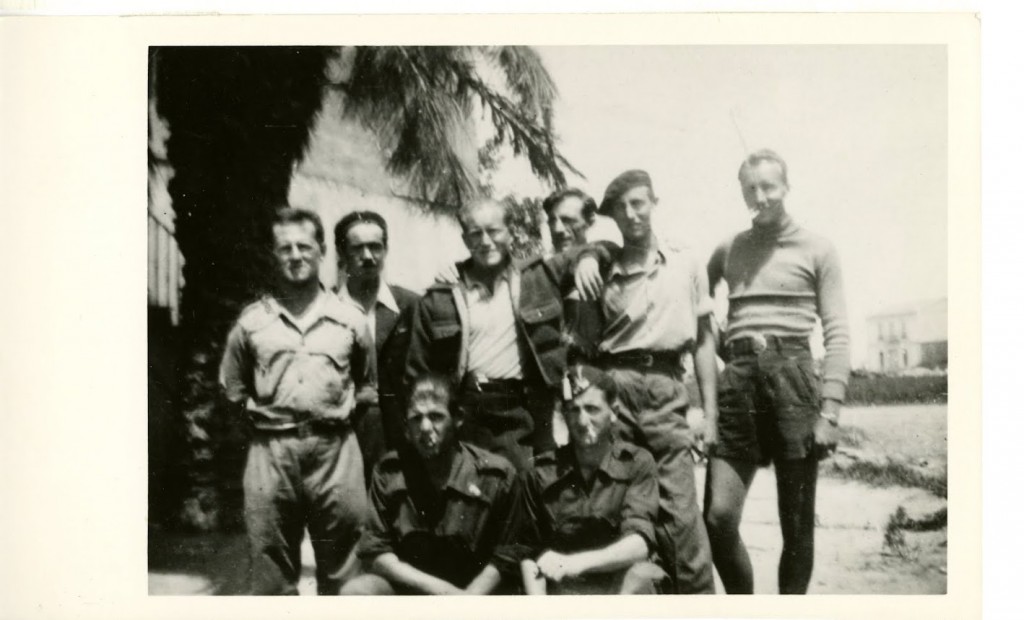 Yanks in the Dimitrov Battery, standing Sam Slipyan, Conlon Nancarrow, Ed Lending, Charles Simpson (?), Delmer Berg, Norman Schmidt, kneeling two Spanish Chauffers.