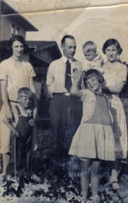 Lloyd Edward Johnson with family, circa 1928-1930. Family photograph.